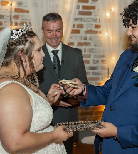 Officiant speaking at a modern wedding ceremony
